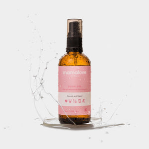 Showcasing Mamalove Body Oil drenched in oil to highlight its rich, smooth texture and luxurious appearance